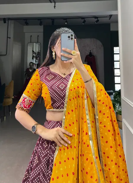 Wine Colour Tussar Silk Bandhej And Patola Print With Foil Work Lehenga With Blouse Dupatta Suppliers In India